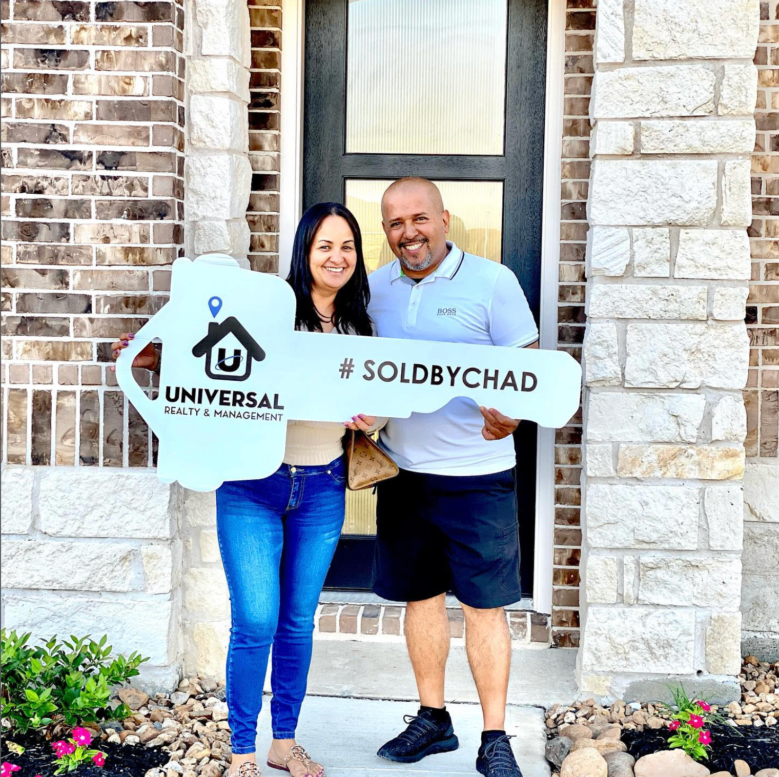 Happy Sold by Chad clients at the front door of their new Texas home